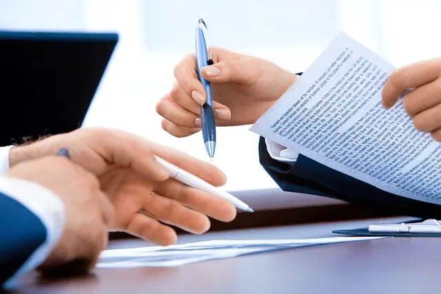 A person looking at a document related to Key Factors to Remember About the Social Security Disability 5-Year Rule