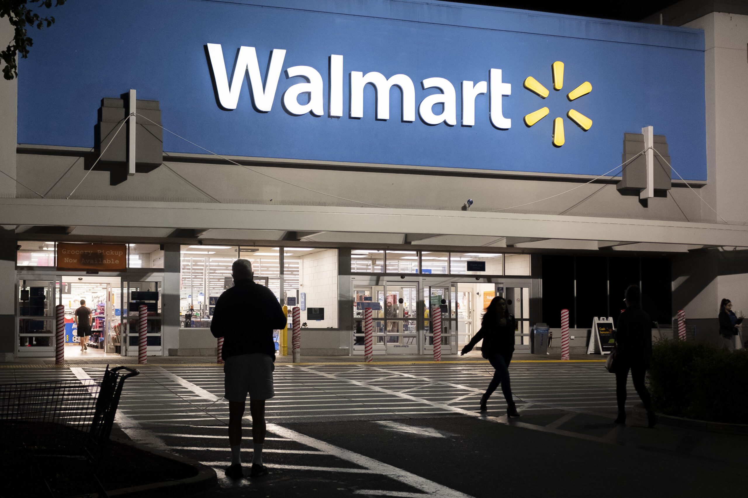 An image of the exterior of Walmart store, open 24 hours