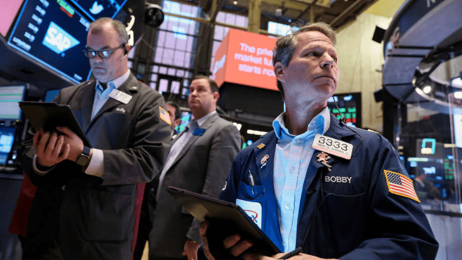 A trader looking at a stock market chart