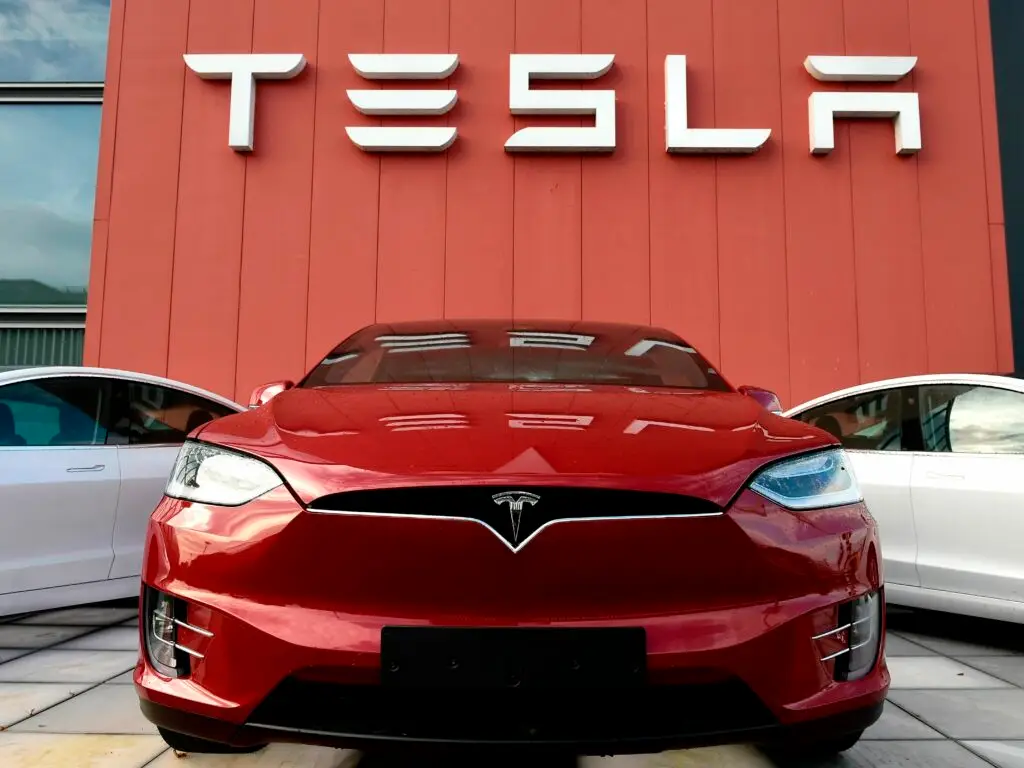 tesla vehicle and logo